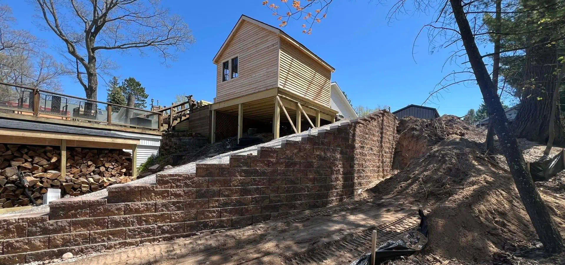wooden cabin house on top of slope retaining wall